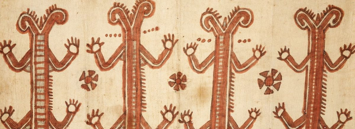 Detail of a beige textile with four stylized animals with long bodies and four limbs in a row