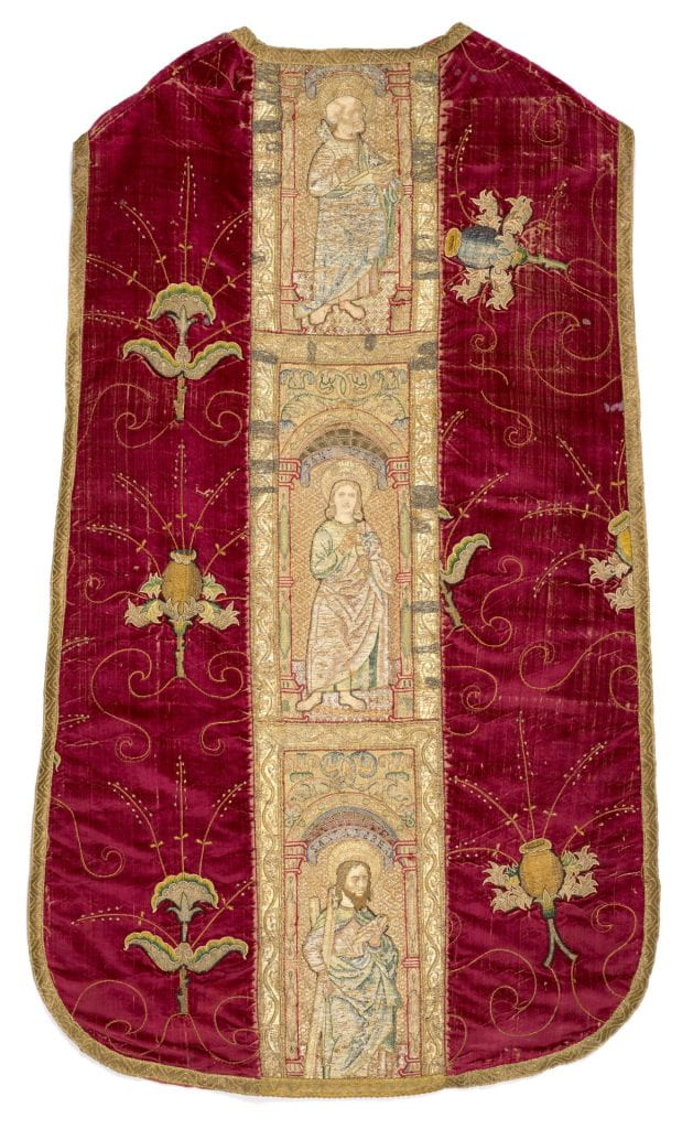 Velvet ecclesiastical chasuble with a vertical band in the center embroidered with figures of depicts Saints Peter, John the Evangelist, and Andrew. Most of the surface is covered with gold thread 